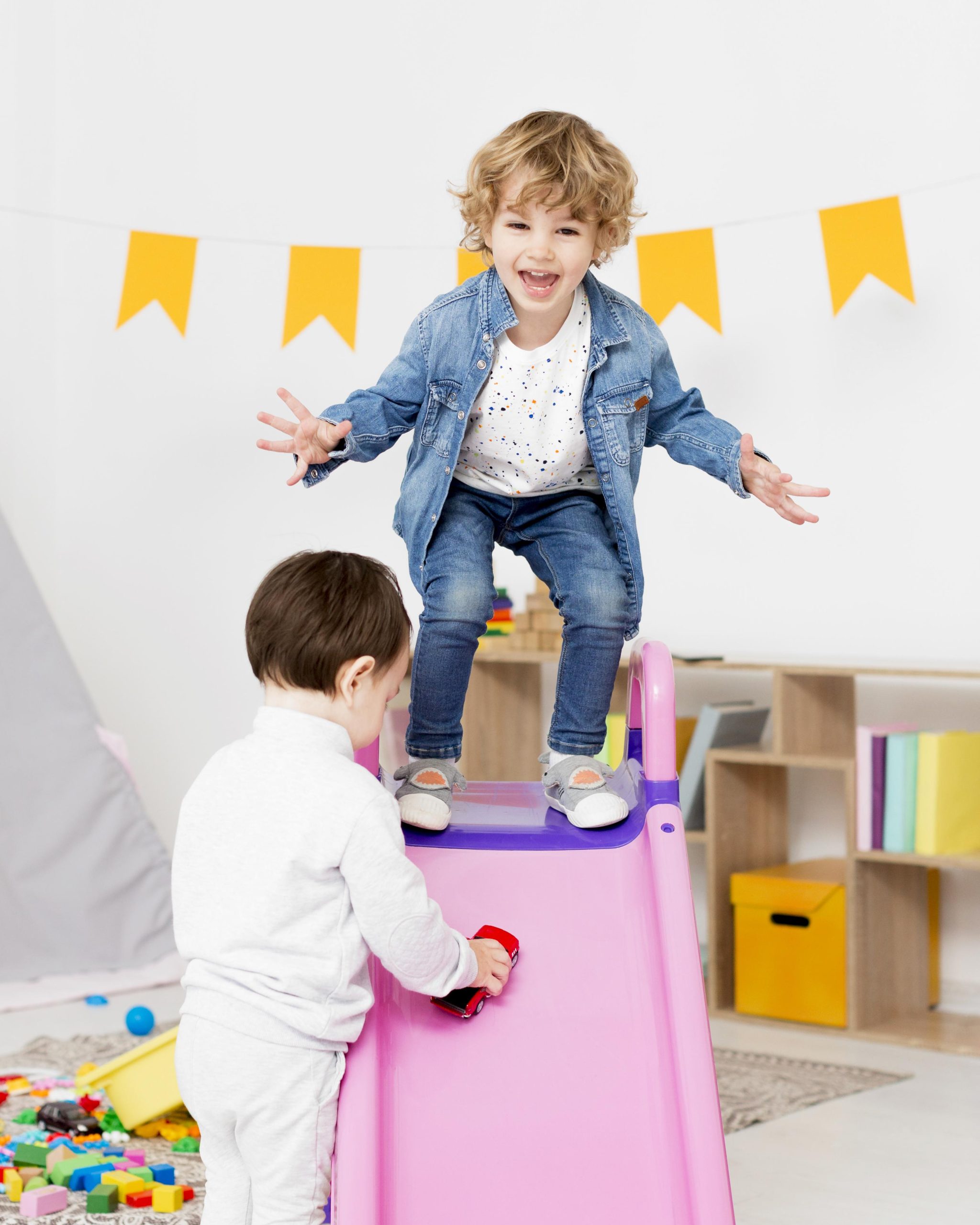 happy-boys-playing-with-toys-slide